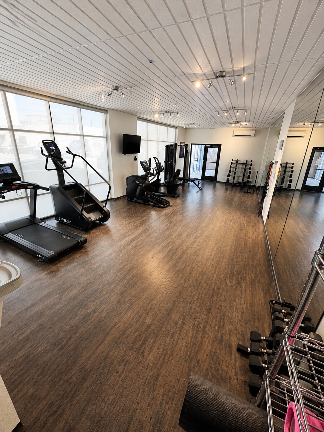 Fitness center with treadmill, stair climber, and free weights